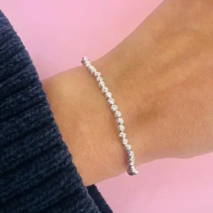 Pulsera elastizada bolitas de plata diamantada